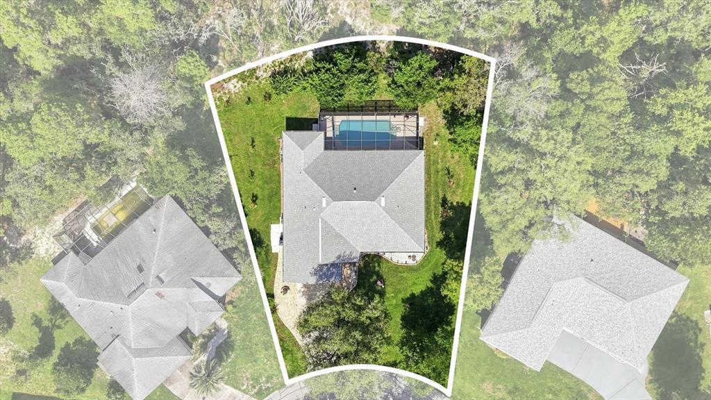 An aerial view shows a house with a screened-in pool on a trapezoidal lot — 6 DUSTY MILLER COURT, HOMOSASSA, FL