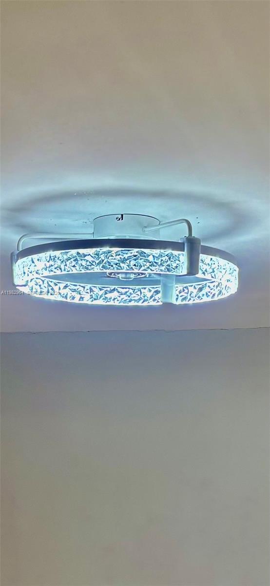 A modern, circular LED ceiling light fixture with a crystal-like textured trim — 2016 NE 26th St # 2, Wilton Manors FL 33305, WILTON MANORS, FL