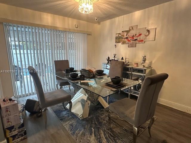 A dining room features a glass-topped table, upholstered chairs, and a multi-panel wall art piece — 6757 Arbor Dr, Miramar FL 33023, MIRAMAR, FL