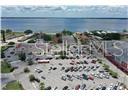 An aerial view shows a large parking lot adjacent to a waterfront area — 1001 LAKEVIEW DRIVE, SEBRING, FL