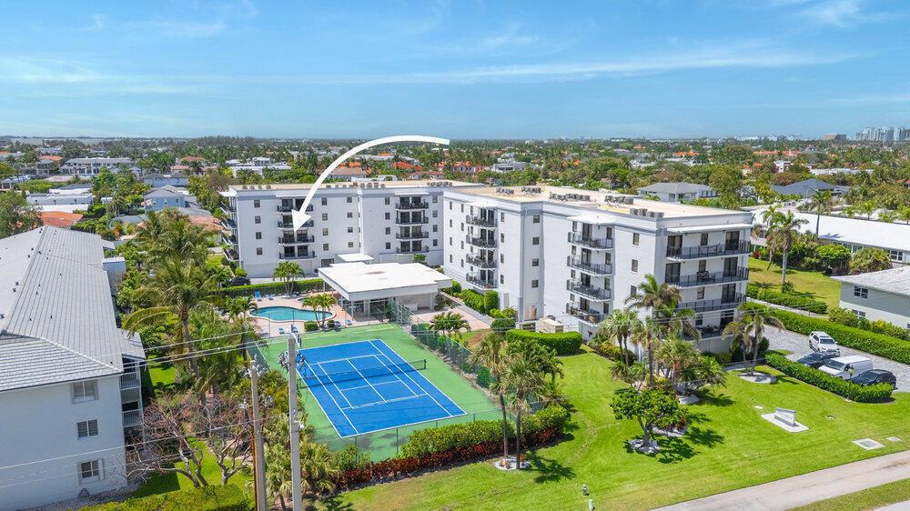 An aerial view of a multi-story apartment complex with a tennis court and swimming pool — 2679 S Ocean Boulevard # 31, Boca Raton FL 33432, BOCA RATON, FL