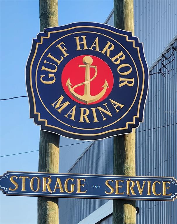 The exterior of the Gulf Harbor Marina building features stacked boat storage inside — 100 CIRCUIT ROAD UNIT S127, NOKOMIS, FL