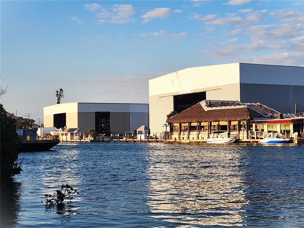 A sign for Gulf Harbor Marina featuring an anchor logo, storage, and service text — 100 CIRCUIT ROAD UNIT S127, NOKOMIS, FL