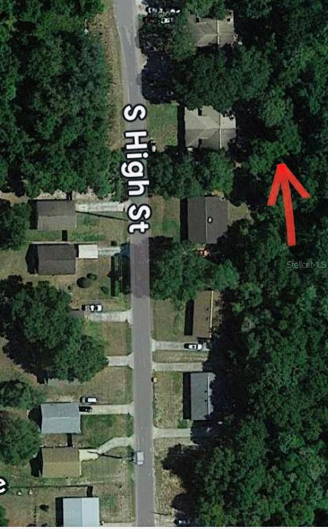 This is an aerial map view showing residential houses along a street with a red arrow — NO STREET, DELAND, FL