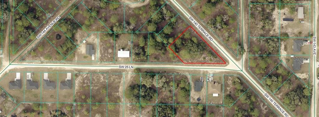 This is an aerial map showing a vacant, irregularly shaped lot outlined in red — SW 140 TERRACE RD, OCALA, FL