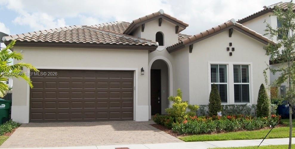 A single-story house with a beige stucco exterior, a tiled roof, and a two-car garage — 14920 SW 175th St, Miami FL 33187, MIAMI, FL