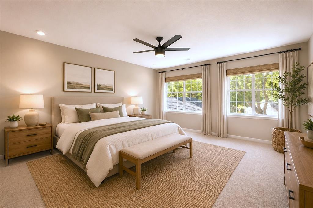 A bedroom features a bed with neutral bedding, a ceiling fan, and two large windows — 641 MAPLE OAK CIRCLE UNIT 101, ALTAMONTE SPRINGS, FL