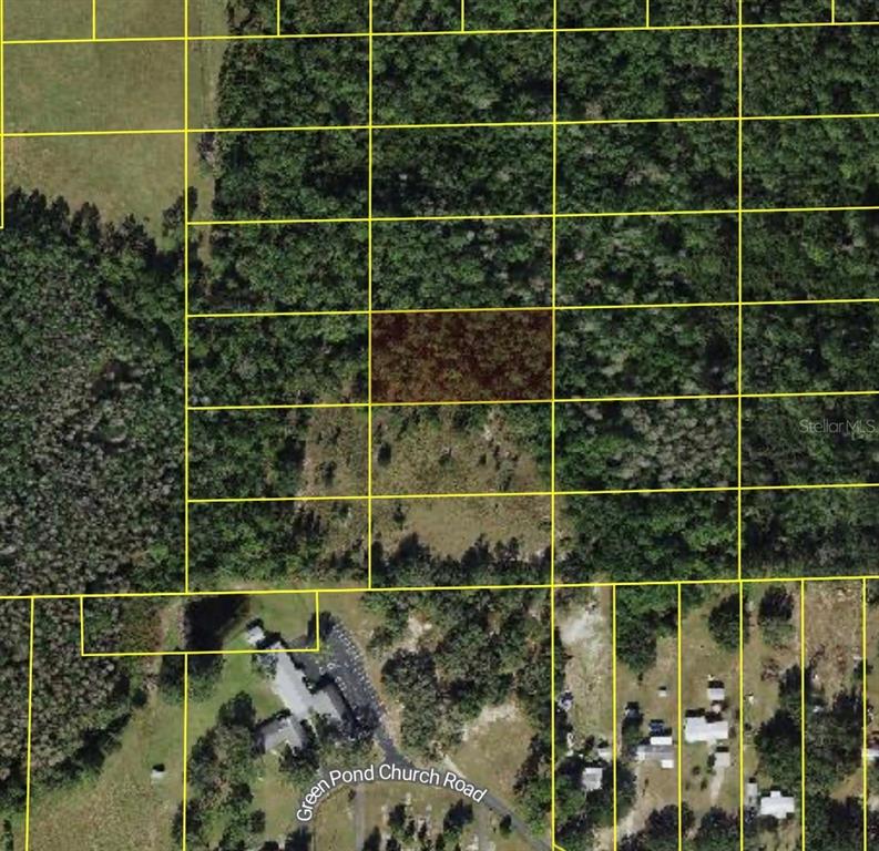 This is an aerial map showing a highlighted rectangular land parcel surrounded by wooded areas — POLK CITY, POLK CITY, FL