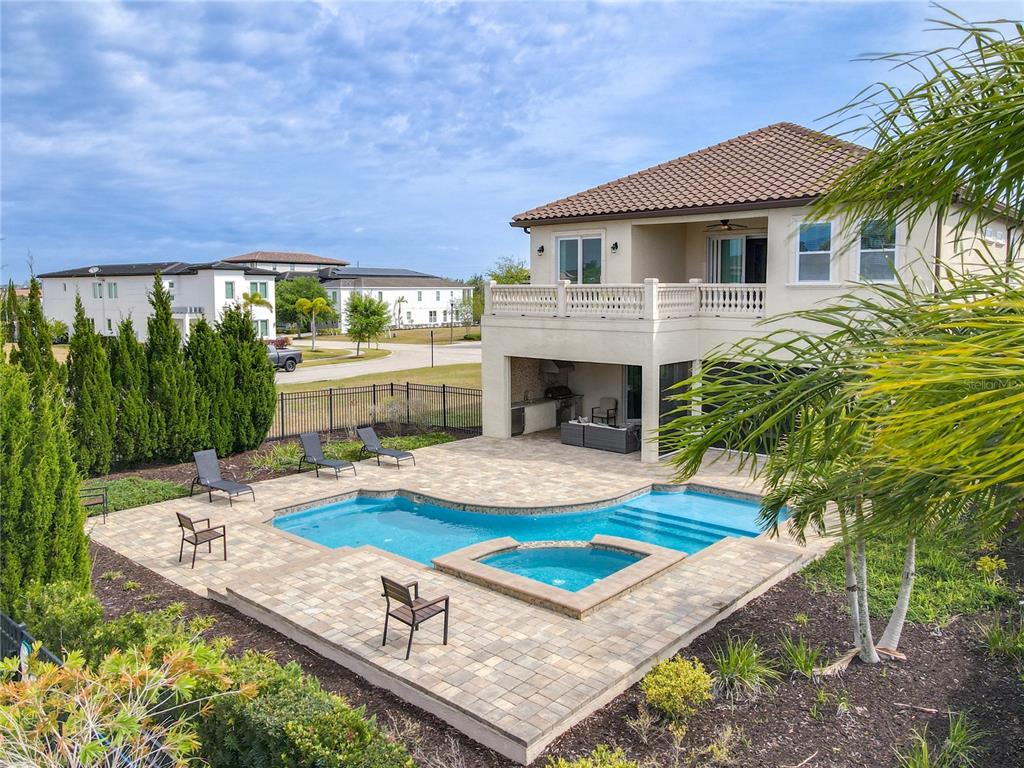 A two-story house with a backyard pool, spa, and covered patio area — 760 GOLDEN BEAR DRIVE, REUNION, FL