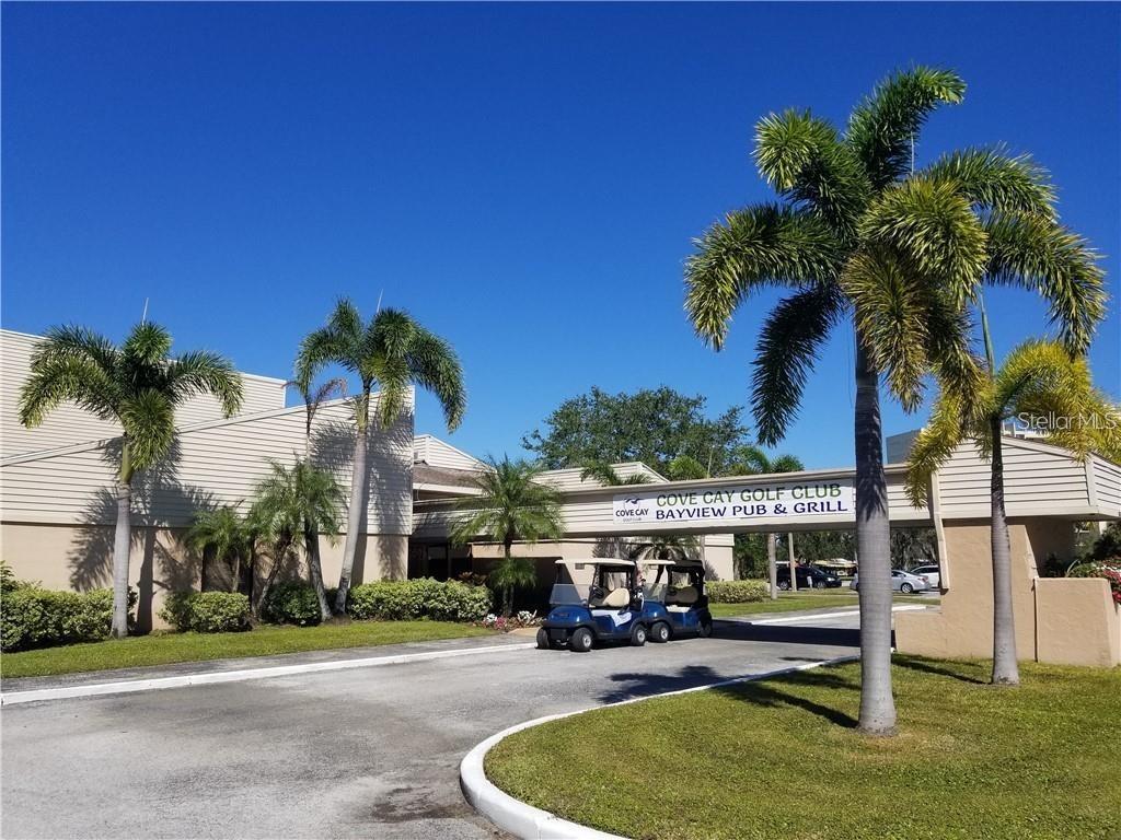 The exterior of the Cove Cay Golf Club and Bayview Pub & Grill features palm trees — 2700 COVE CAY DRIVE UNIT 1-6D, CLEARWATER, FL