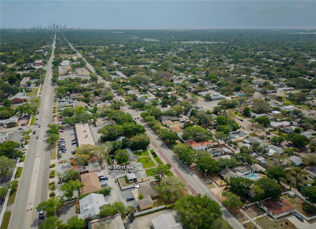 An aerial view shows a residential neighborhood with a highlighted house and surrounding streets — 6465 1ST AVENUE S, ST PETERSBURG, FL