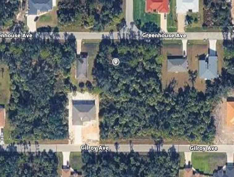 This aerial map view shows a vacant wooded lot situated between two residential streets — Lot 5 GREENHOUSE AVENUE, NORTH PORT, FL