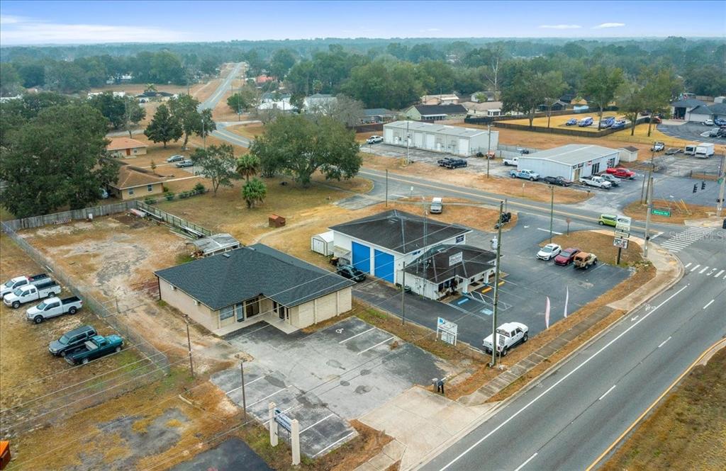 An aerial view shows a commercial property with two buildings and a parking lot — 2733 SE 58TH AVENUE, OCALA, FL