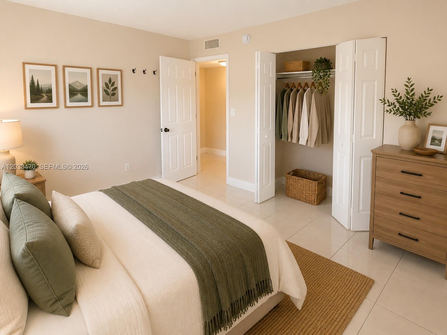 A bedroom features a bed with green accents, a closet, and a wooden dresser — 5461 W 24th Ave # 18, Hialeah FL 33016, HIALEAH, FL