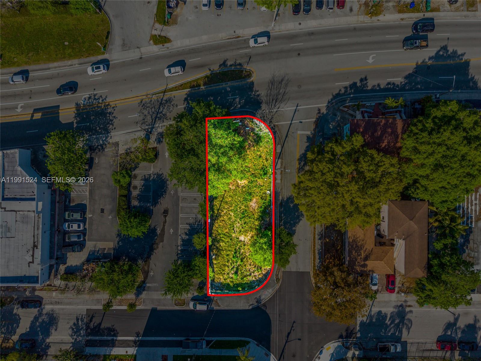 This aerial view shows a vacant, rectangular lot outlined in red between two paved streets — 5434 NE Miami Ct, Miami FL 33137, MIAMI, FL