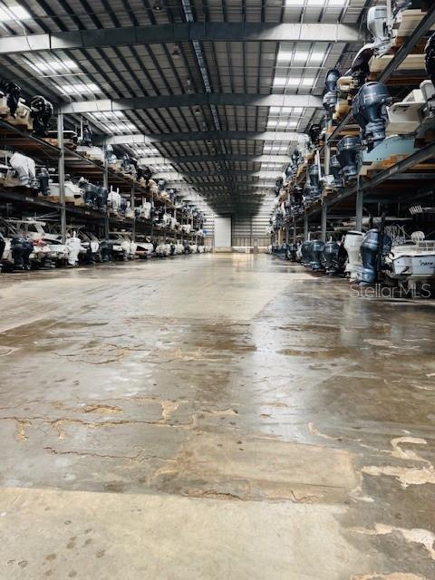 A large indoor boat storage facility with multiple levels of stacked watercraft — 1780 PHILLIPPI SHORES DRIVE UNIT A3-22, SARASOTA, FL