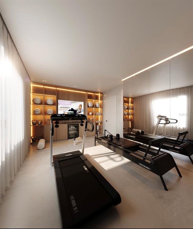 This is a rendering of a modern home gym featuring a treadmill and a pilates reformer — 6645 N OCEAN SHORE BOULEVARD UNIT 5B, PALM COAST, FL