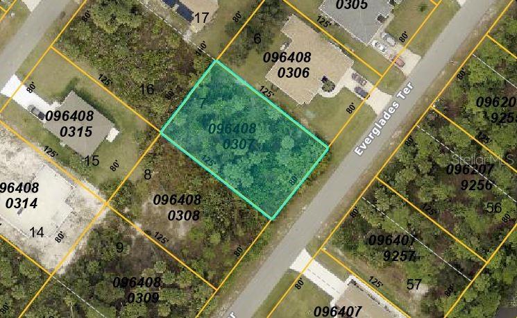 This is an aerial map showing a highlighted vacant residential lot along a paved road — Lot 7 EVERGLADES TERRACE, NORTH PORT, FL