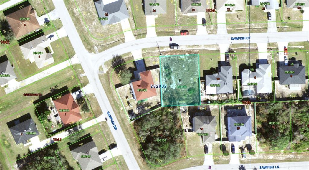 This is an aerial map showing a vacant residential lot highlighted in blue — 61 SAWFISH COURT, KISSIMMEE, FL