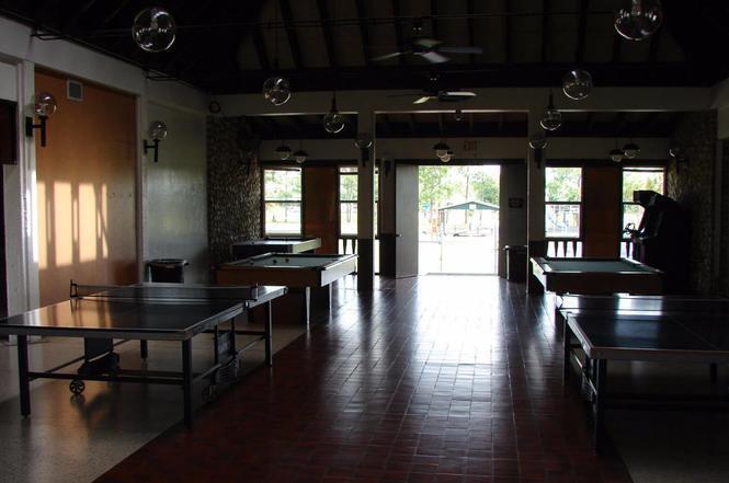 A game room features two ping pong tables, two pool tables, and tile flooring — 560 S Palm Street, Clewiston FL 33440, CLEWISTON, FL