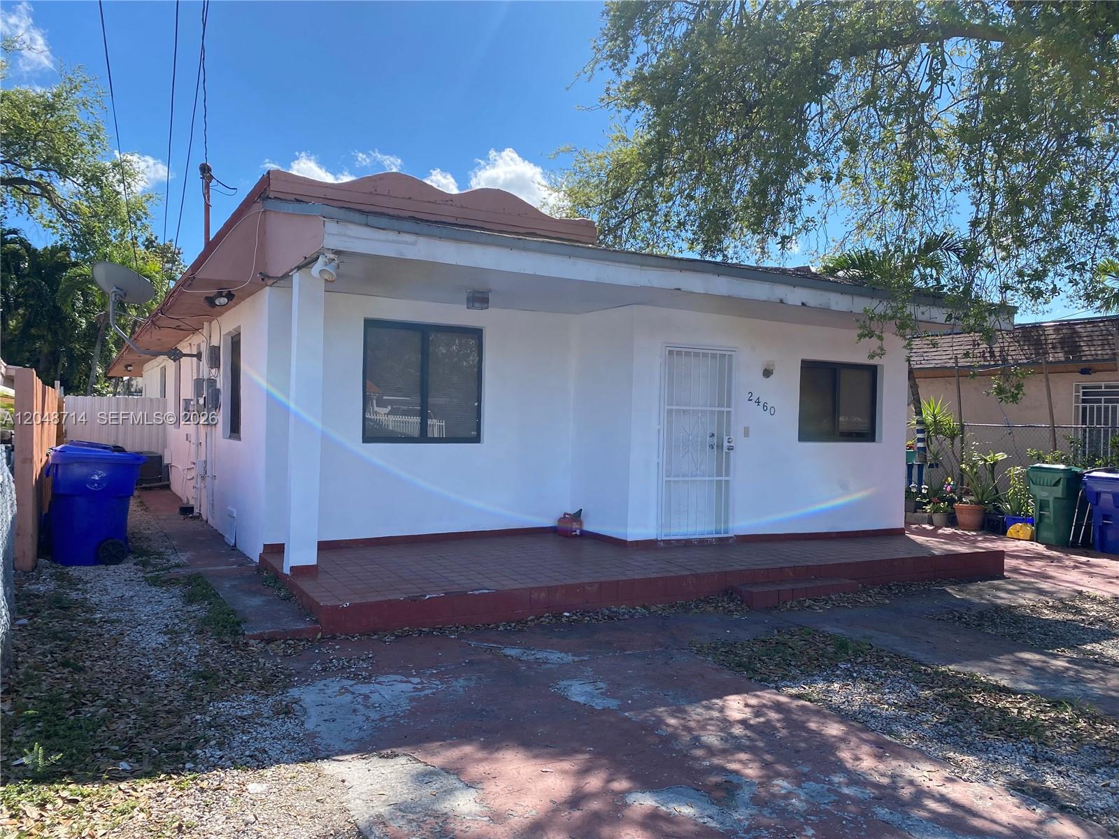 A single-story white house with a front porch and a red-tiled roof — 2460 NW 15th St # 4, Miami FL 33125, MIAMI, FL