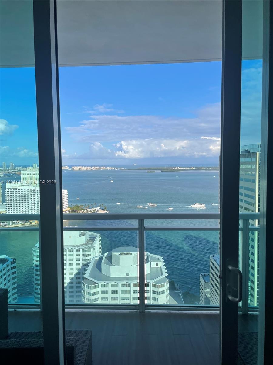 A view of the ocean and city skyline from a high-rise balcony — 951 Brickell Ave # 3506, Miami FL 33131, MIAMI, FL