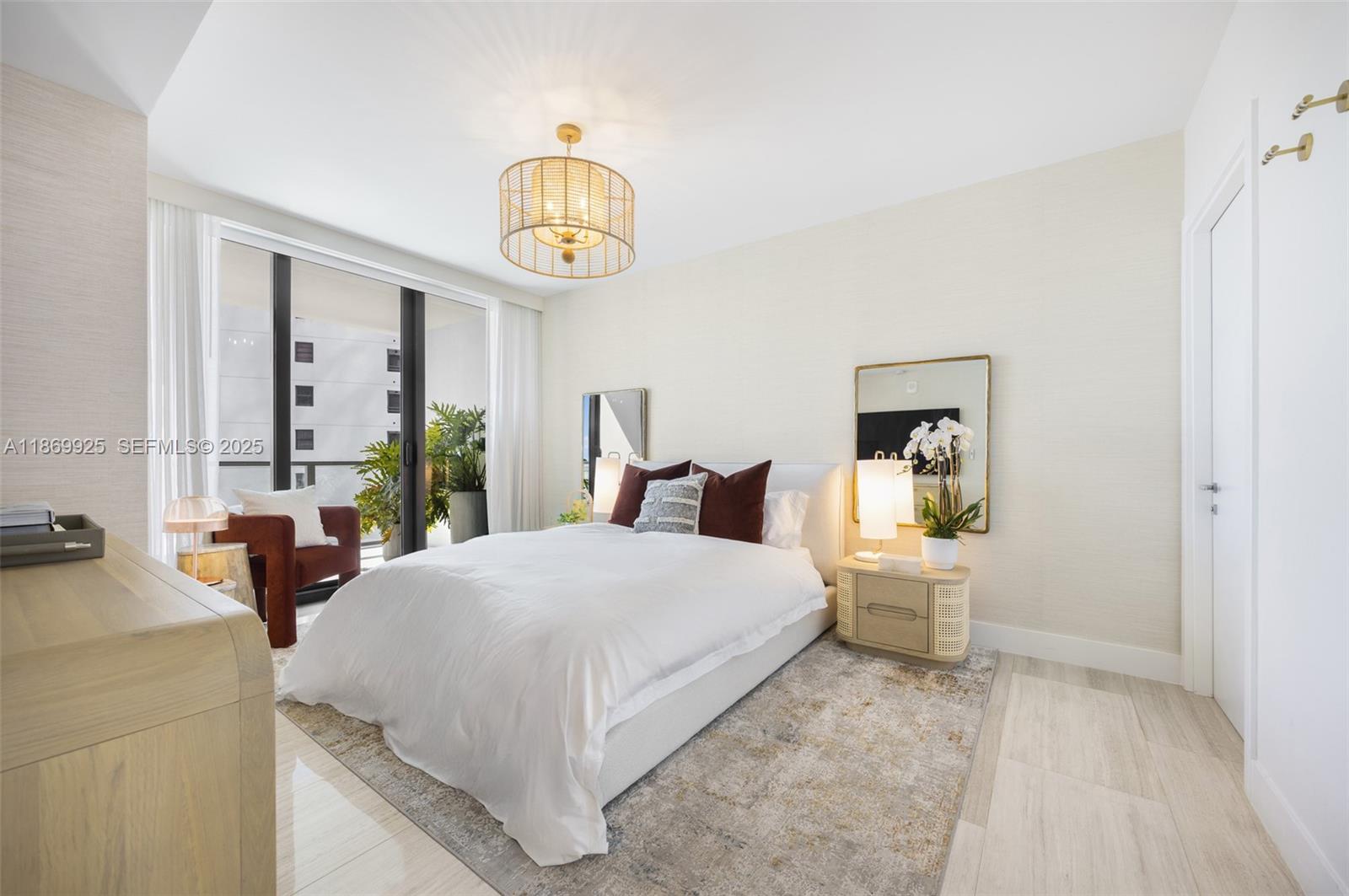 A modern bedroom features a white bed, a rattan nightstand, and a balcony view — 1451 Brickell Ave # 1901, Miami FL 33131, MIAMI, FL