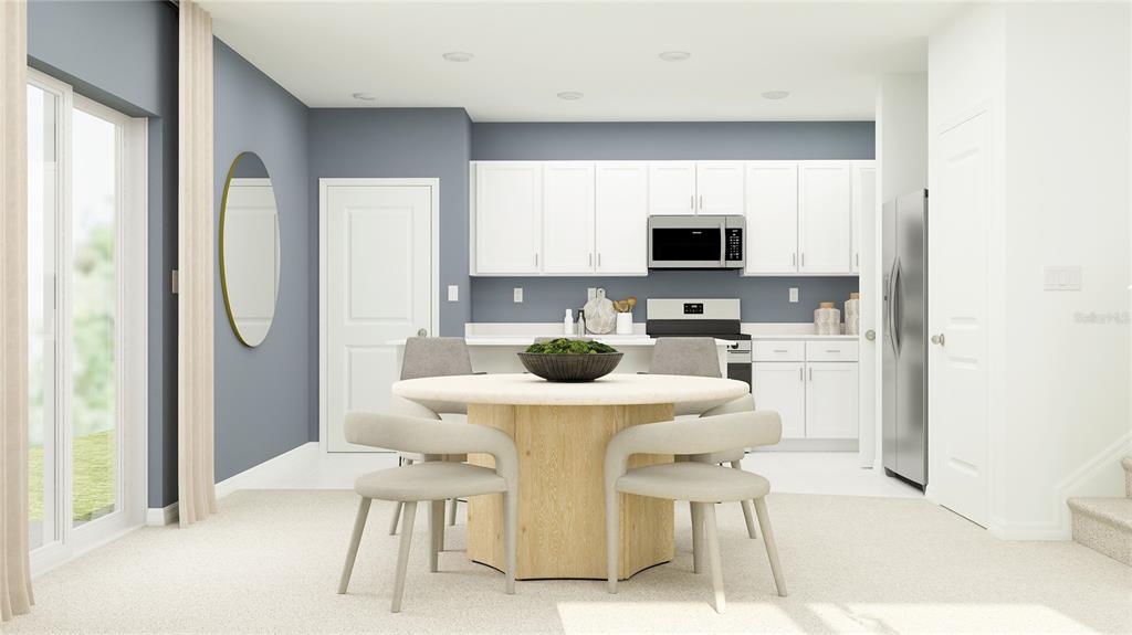 This digital rendering shows a dining area and kitchen with white cabinets and blue walls — 10623 SAGE CANYON DRIVE, RIVERVIEW, FL