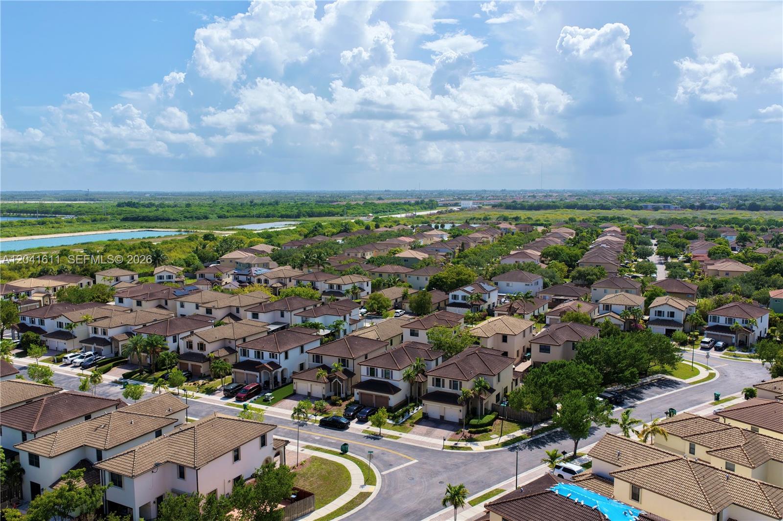 An aerial view shows a suburban neighborhood with many two-story houses and paved streets — 22732 SW 92nd Pl, Cutler Bay FL 33190, CUTLER BAY, FL