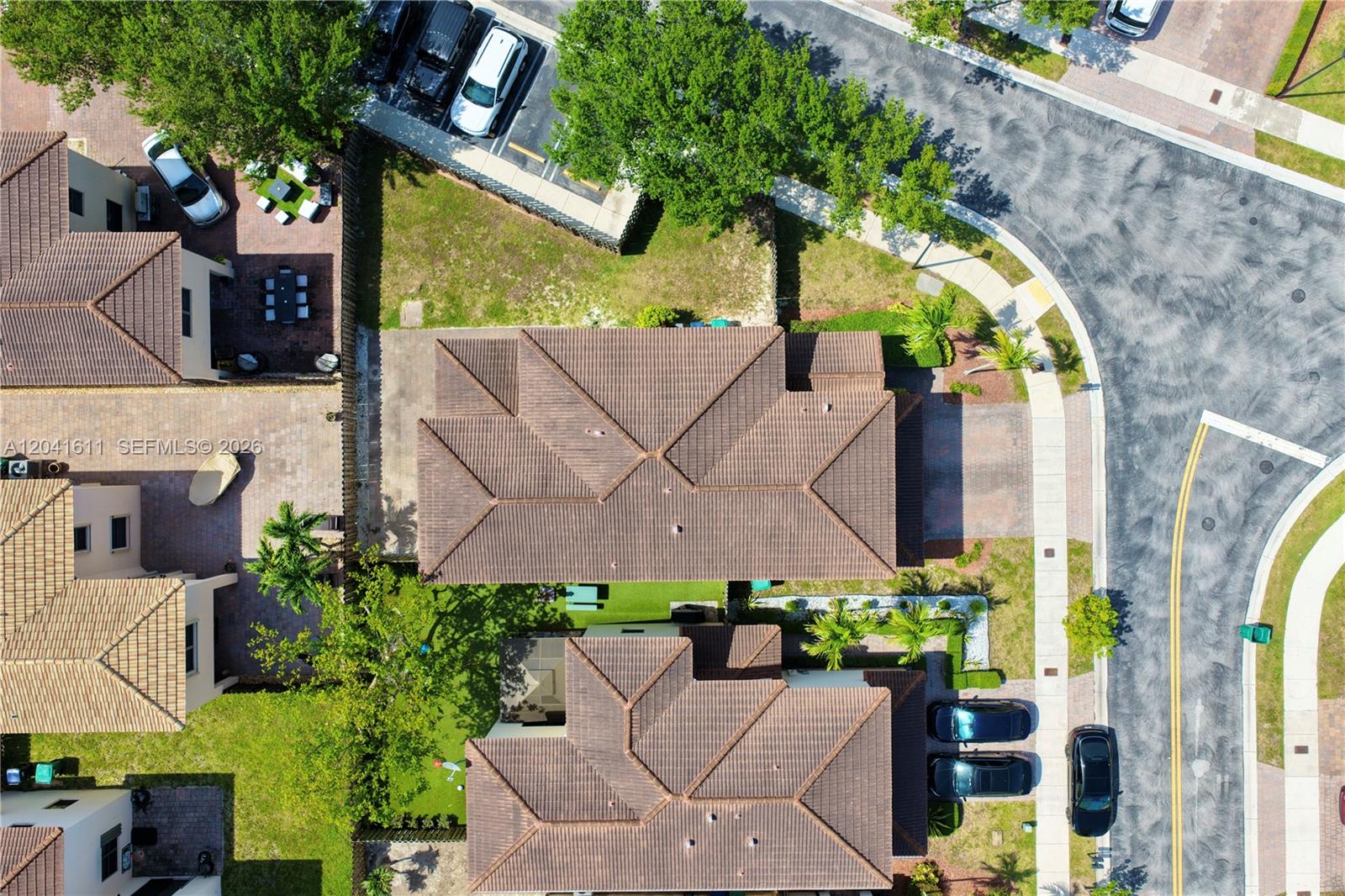 An aerial view shows two residential houses with tiled roofs, driveways, and landscaped yards — 22732 SW 92nd Pl, Cutler Bay FL 33190, CUTLER BAY, FL