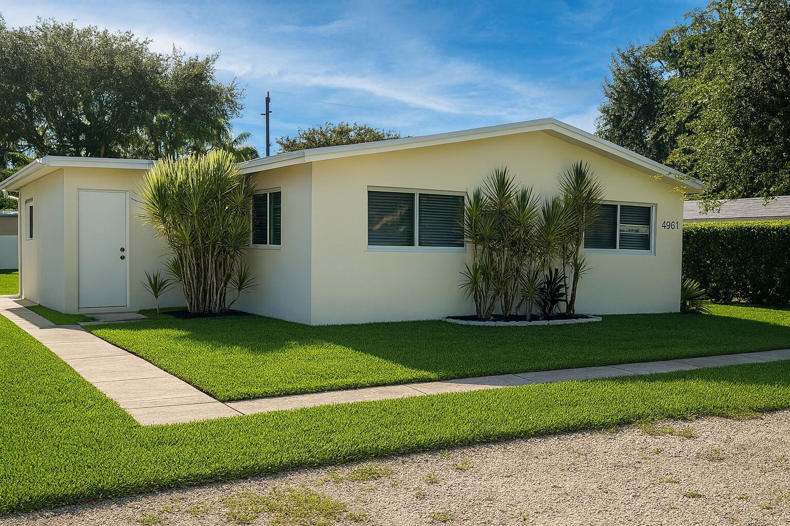 A single-story, light yellow house with a flat roof and a concrete walkway — 4961 SW 28th Terrace # 2, Dania Beach FL 33004, DANIA BEACH, FL