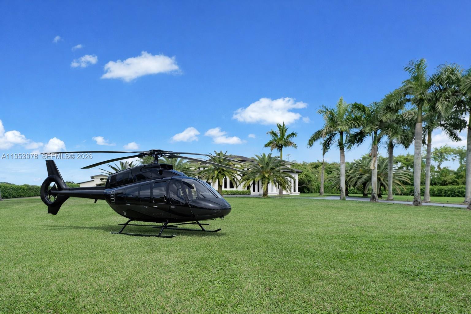 A black helicopter is parked on a grassy lawn in front of a house — 17805 SW 158th St, Miami FL 33187, MIAMI, FL