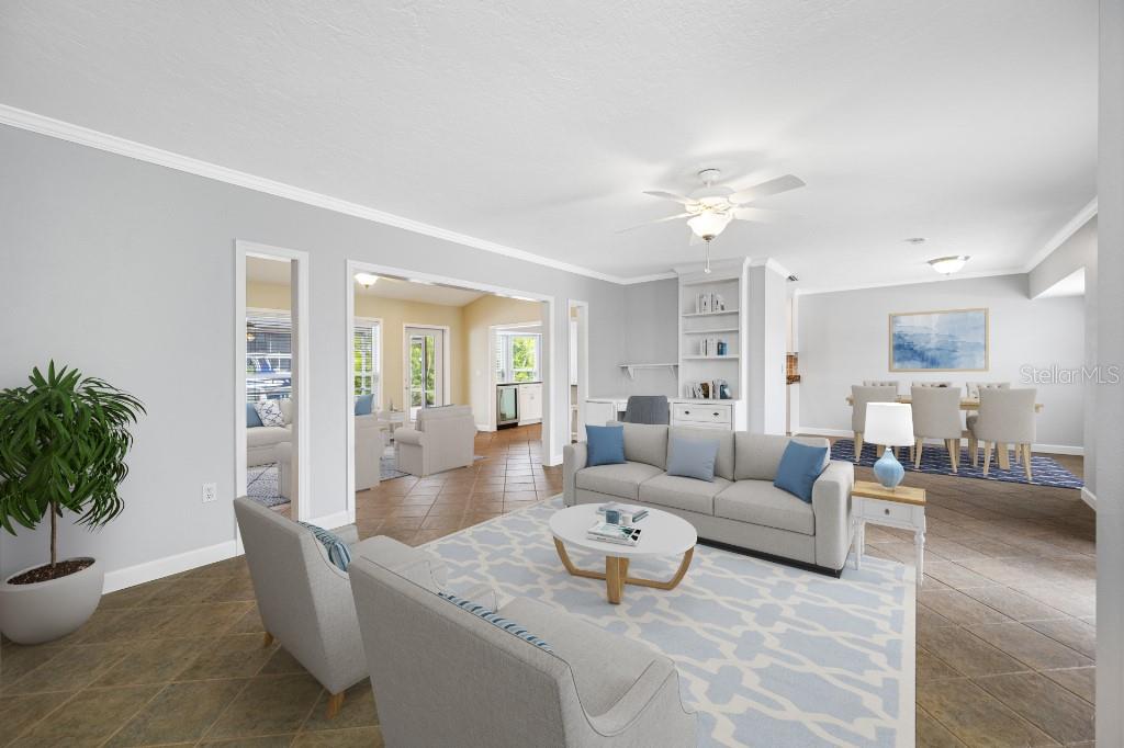 This is a digital rendering of a living room with tile floors and neutral furniture — 10308 SANDPIPER ROAD W, BRADENTON, FL