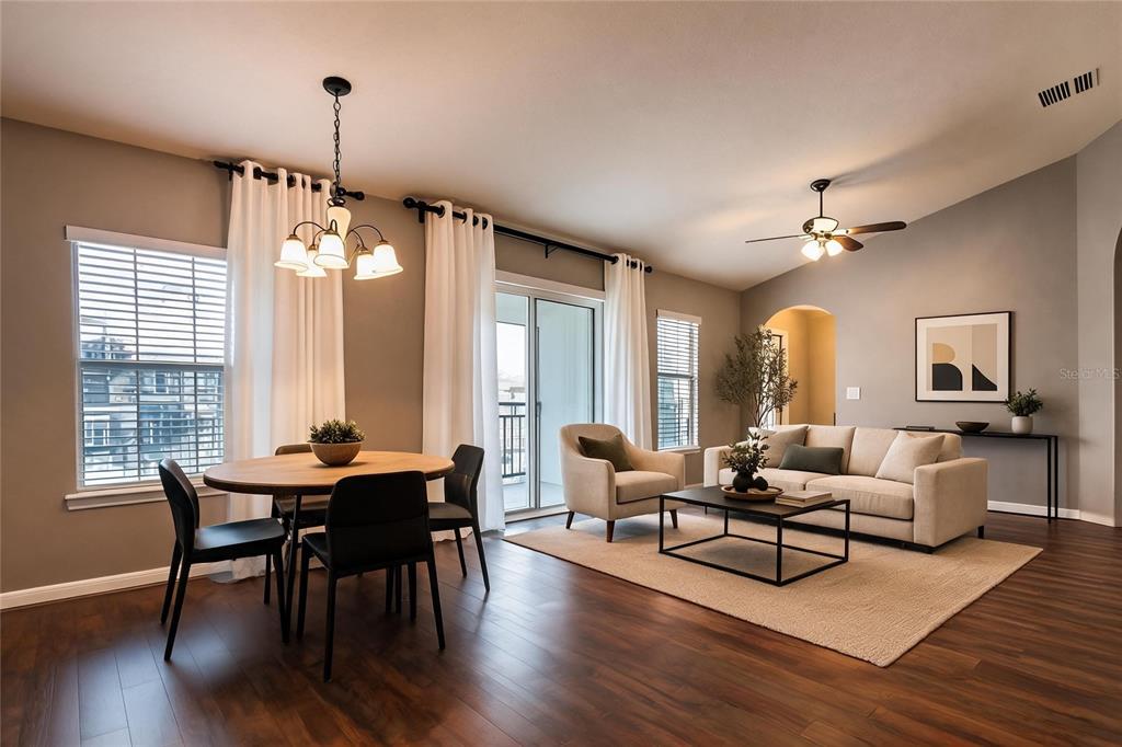A two-story townhouse exterior features green stucco walls, stone veneer, and a single-car garage — 7001 INTERBAY BOULEVARD UNIT 178, TAMPA, FL