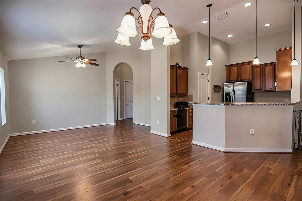 A green two-story townhouse exterior features a black front door and a large tropical plant — 7001 INTERBAY BOULEVARD UNIT 178, TAMPA, FL