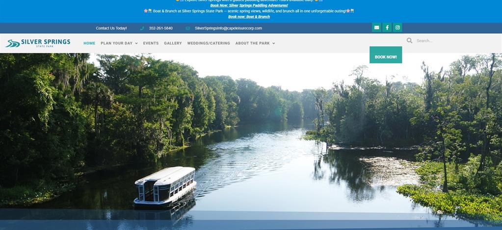 A tour boat travels down a river surrounded by dense forest at Silver Springs State Park — 69 SE, OCKLAWAHA, FL