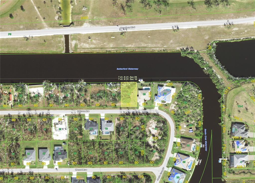 This is an aerial map showing residential lots along a waterway — 14238 OSTROM (LOT 19) AVENUE, PORT CHARLOTTE, FL