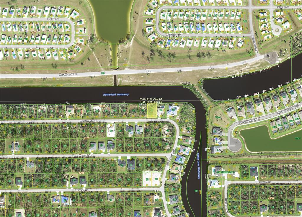 This is an aerial map showing residential lots, streets, and waterways in a suburban neighborhood — 14238 OSTROM (LOT 19) AVENUE, PORT CHARLOTTE, FL