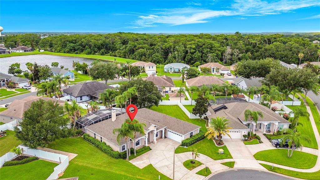 An aerial view of a suburban house with a red location pin on the roof — 3910 COUNTRYSIDE VIEW COURT, ST CLOUD, FL