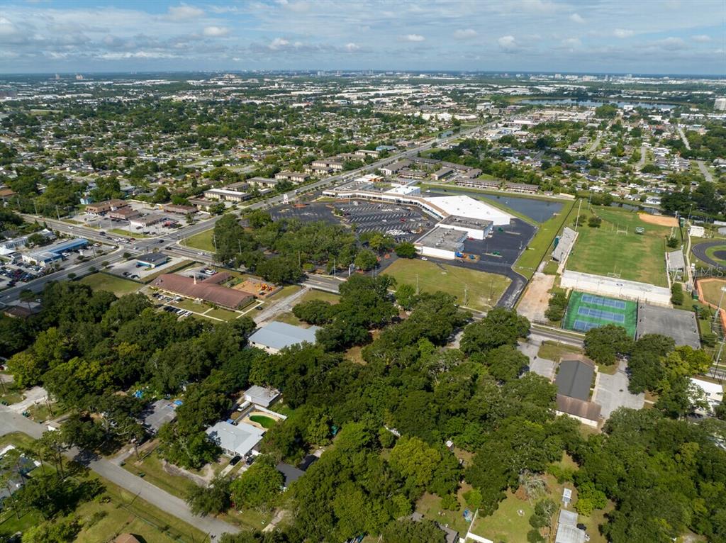 An aerial view shows a commercial shopping center, surrounding residential neighborhoods, and a nearby park — 6203 WINEGARD ROAD, ORLANDO, FL