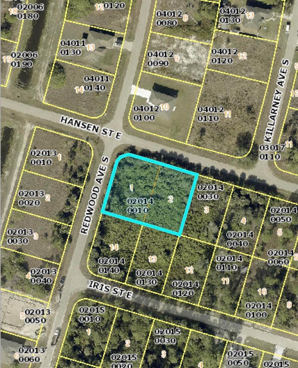 This is a satellite map view showing a vacant, wooded residential lot outlined in blue — 952 Hansen Street E, Lehigh Acres FL 33974, LEHIGH ACRES, FL