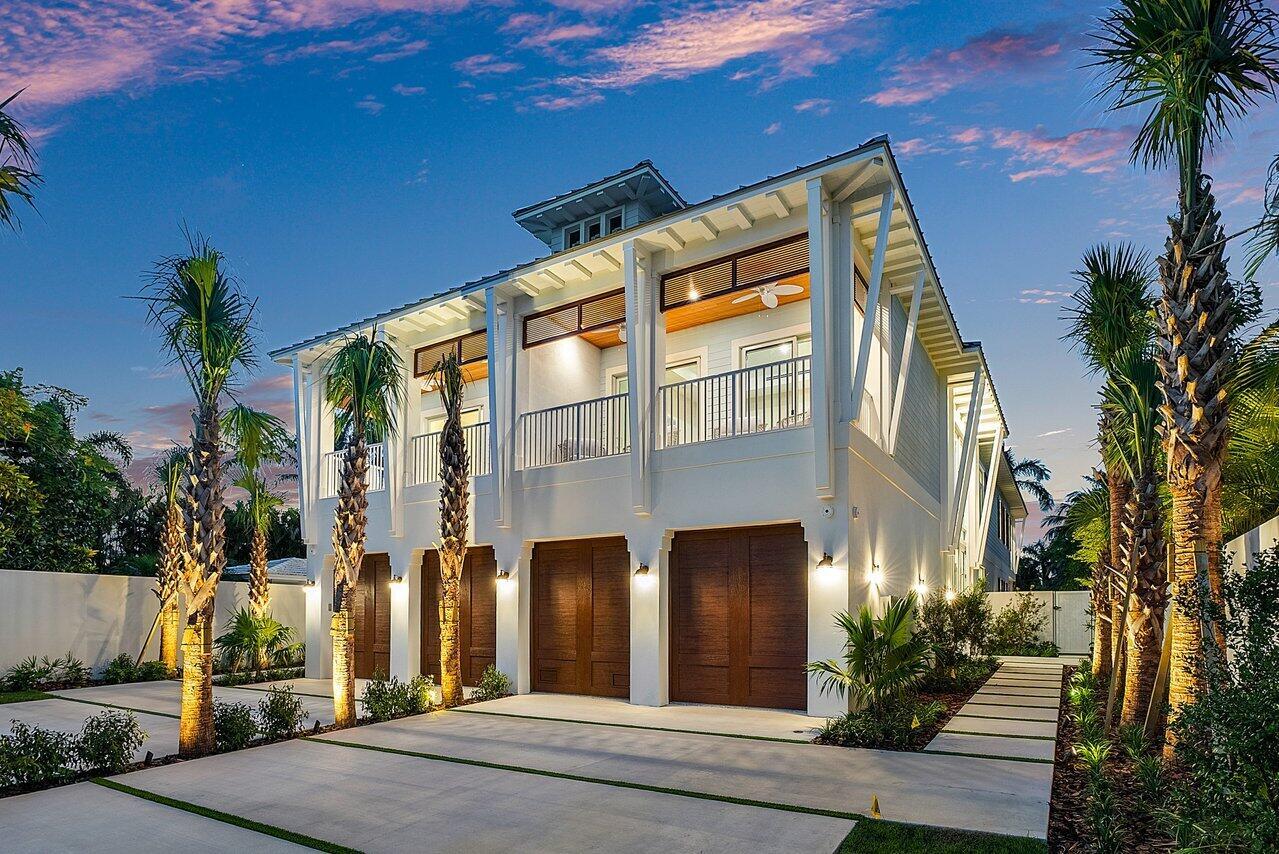 A two-story house with a three-car garage, white exterior, and a large second-floor balcony — 909 Bond Way, Delray Beach FL 33483, DELRAY BEACH, FL