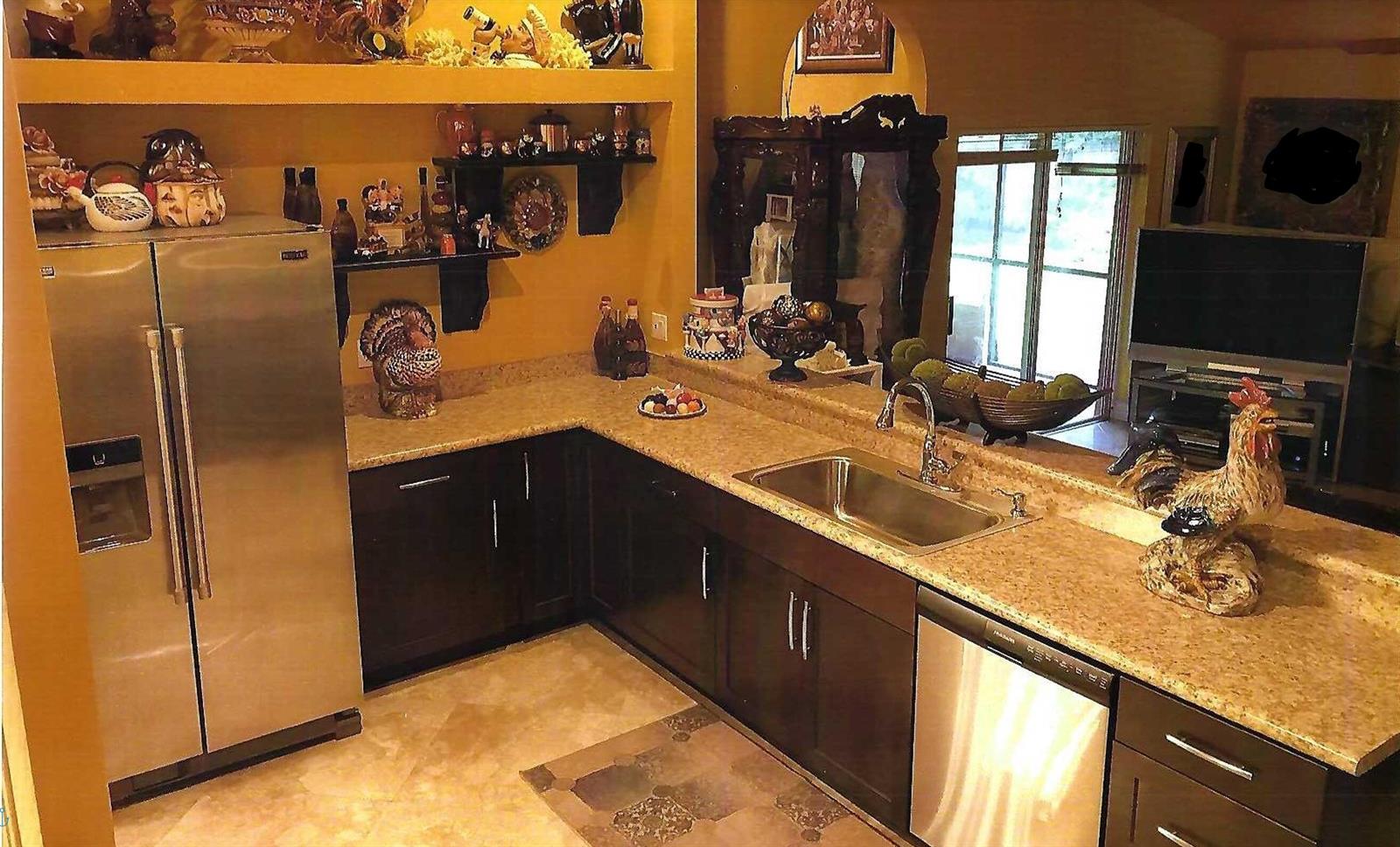 A kitchen features dark wood cabinets, granite countertops, stainless steel appliances, and open shelving — 8862 Jaspers Drive, Boynton Beach FL 33472, BOYNTON BEACH, FL