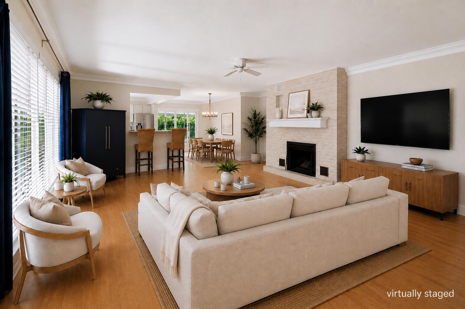 A virtually staged living room with a brick fireplace, light wood floors, and open floor plan — 2685 SE 6th Street, Pompano Beach FL 33062, POMPANO BEACH, FL