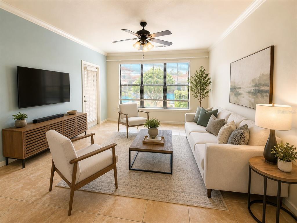 A living room features a light-colored sofa, two armchairs, a coffee table, and a television — 907 CHARO PARKWAY UNIT 915, DAVENPORT, FL