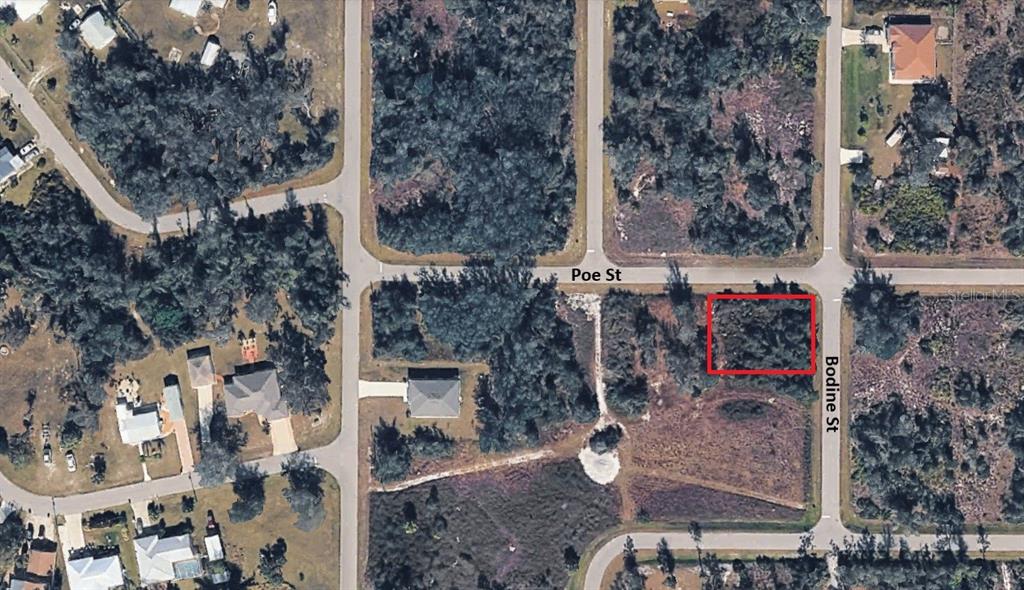 An aerial map view shows a vacant, rectangular lot highlighted in red at a street intersection — 211 BODINE STREET, PUNTA GORDA, FL