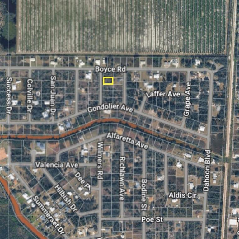 This is an aerial map showing a highlighted rectangular property lot located along a road — 30 WILMERS ROAD, PUNTA GORDA, FL
