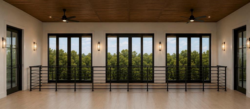This is a rendering of a modern balcony with black railings, ceiling fans, and large windows — 3904 DANA SHORES DRIVE, TAMPA, FL