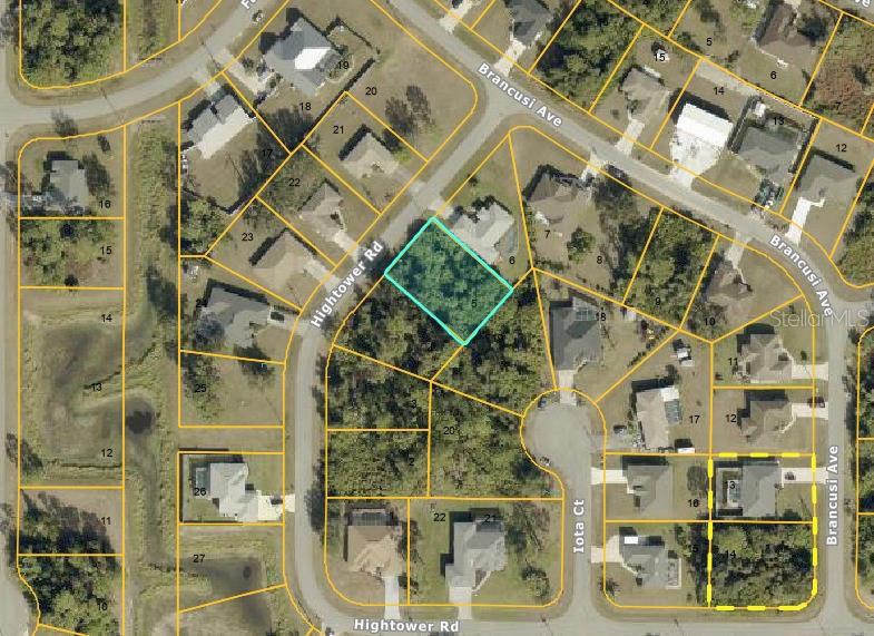 This is an aerial map showing a highlighted vacant residential lot in a suburban neighborhood — HIGHTOWER ROAD, NORTH PORT, FL