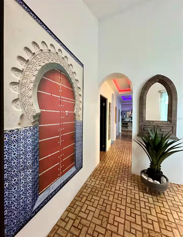 A hallway features a large Moroccan-style door print, a decorative mirror, and patterned tile flooring — 13 CALLE VILLA INTERNACIONAL 2, SAN JUAN, PR